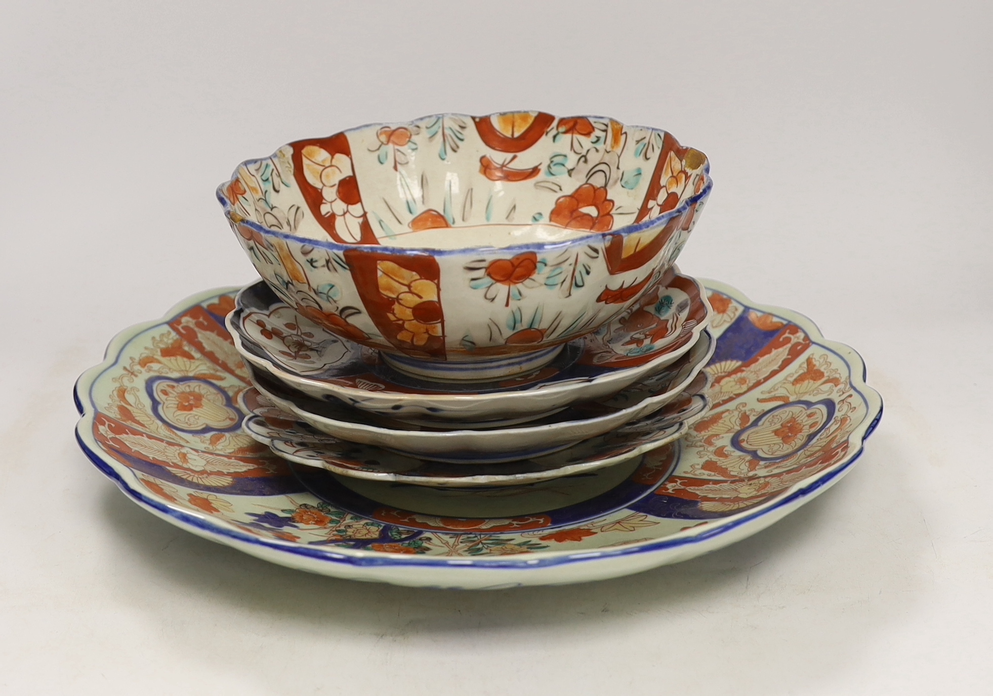 A group of Imari wares comprising bowl, charger and three dishes, largest 37cm in diameter